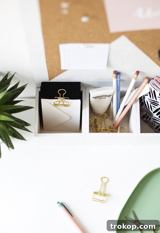 Craft Your Custom Desk Organizer 10 The completed modern DIY desk organizer with a white and cork geometric bulletin board design, ready to organize office supplies.