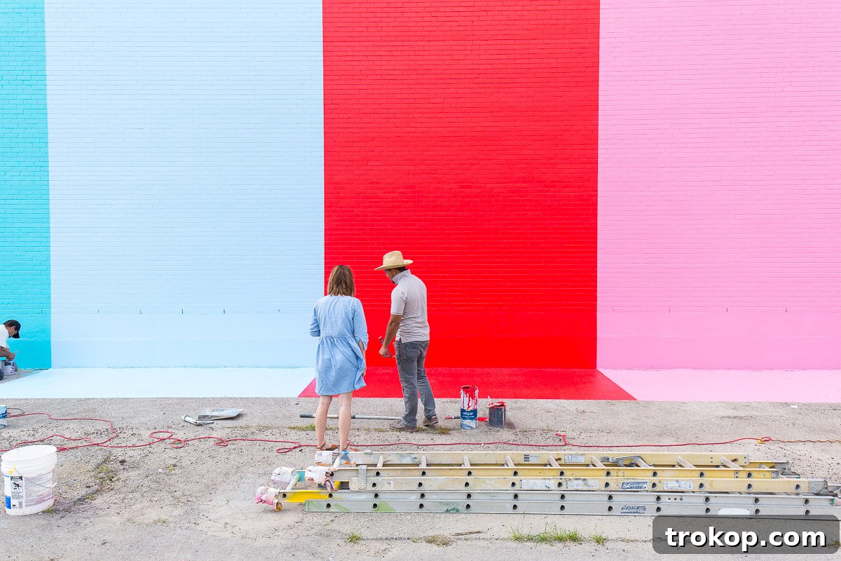 Professional painters at work on the Sugar and Cloth color wall in Houston.