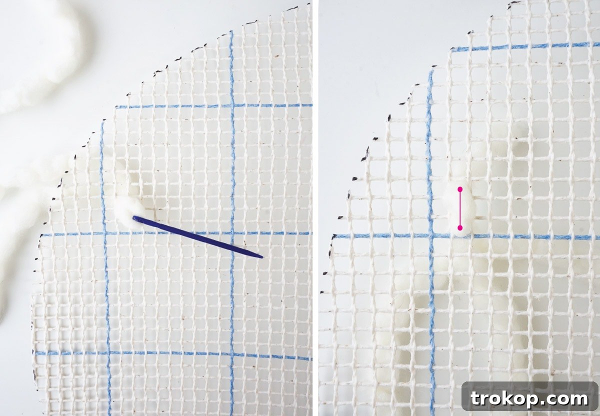 Artisan Oversized Cross-Stitch Pillow 5 Cutting two circular shapes from the graph n' latch rug canvas, establishing the foundation for the oversized cushion.