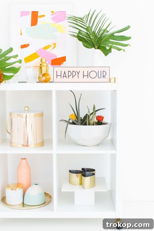 Bar cart adorned with DIY tropical floral swag and refreshing drinks