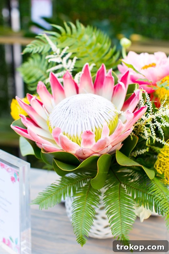Elegant table setting with tropical centerpieces and refreshing drinks