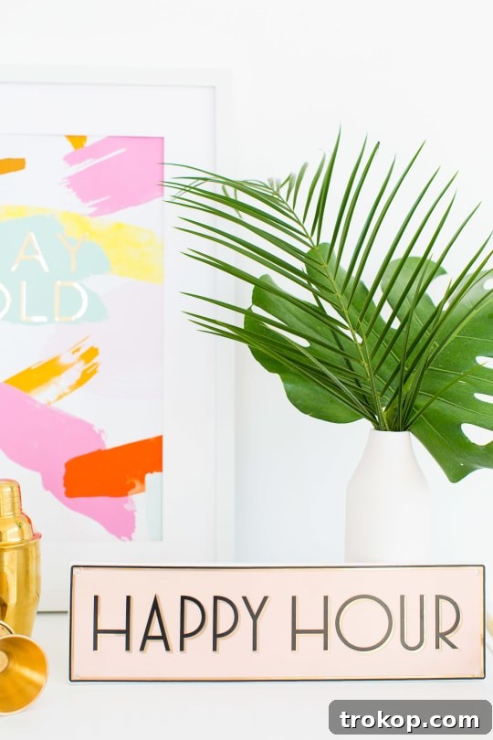 Beautifully styled bar cart with tropical decor for a summer event