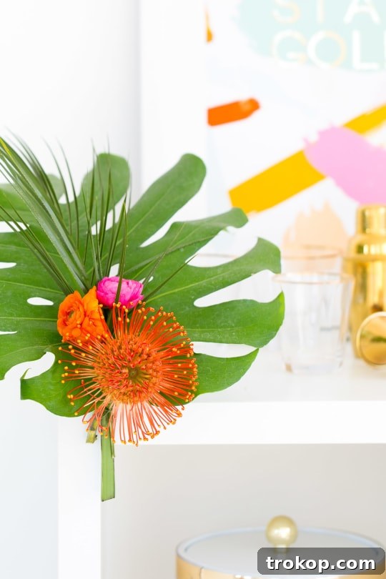 Materials for DIY floral bar cart swag, including wires, palm leaves, and fresh flowers