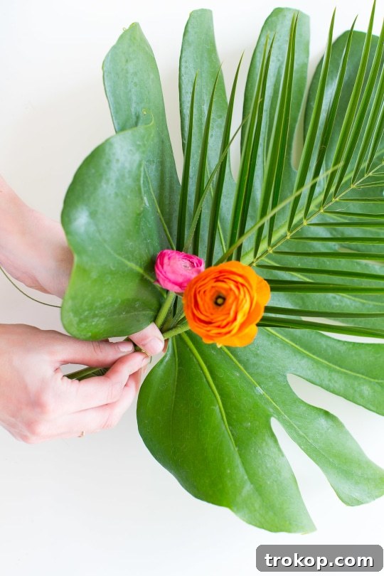 Securing palm leaves with floral wire as the base for the swag