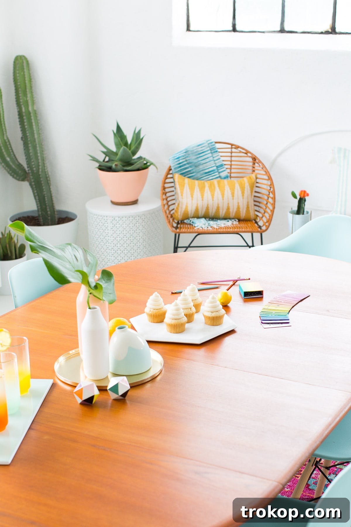Detailed view of a modern dining room setting with blue accents and artwork