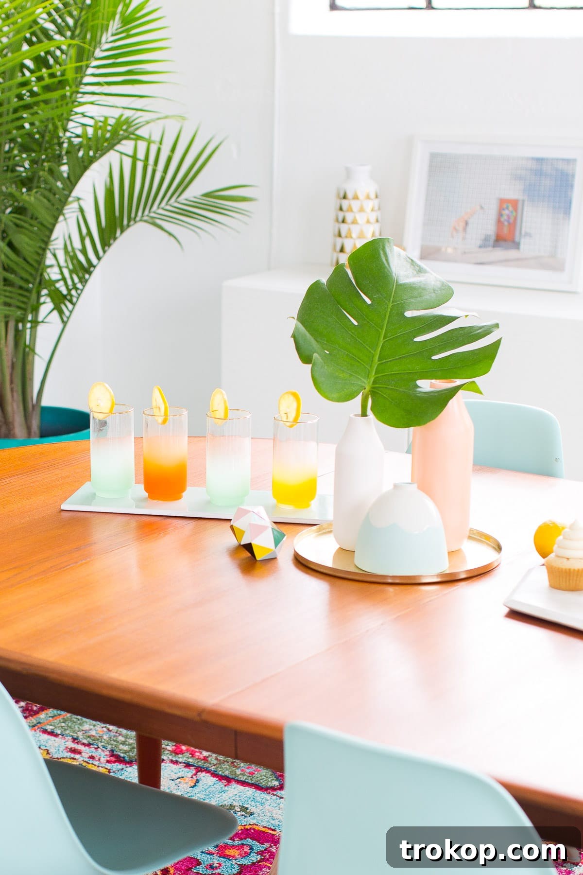 Close-up of dining table decor with fresh fruit and Air Wick warmer for summer