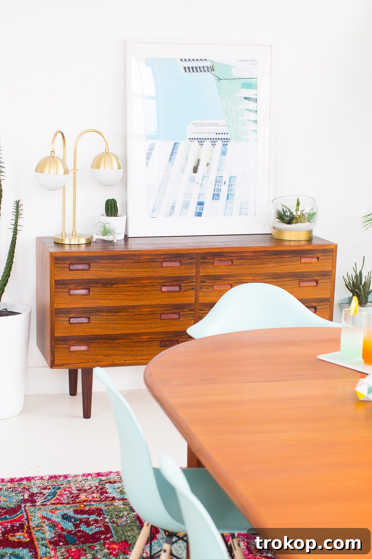 Joyful and modern dining room decor with colorful vases, glassware, and summer treats