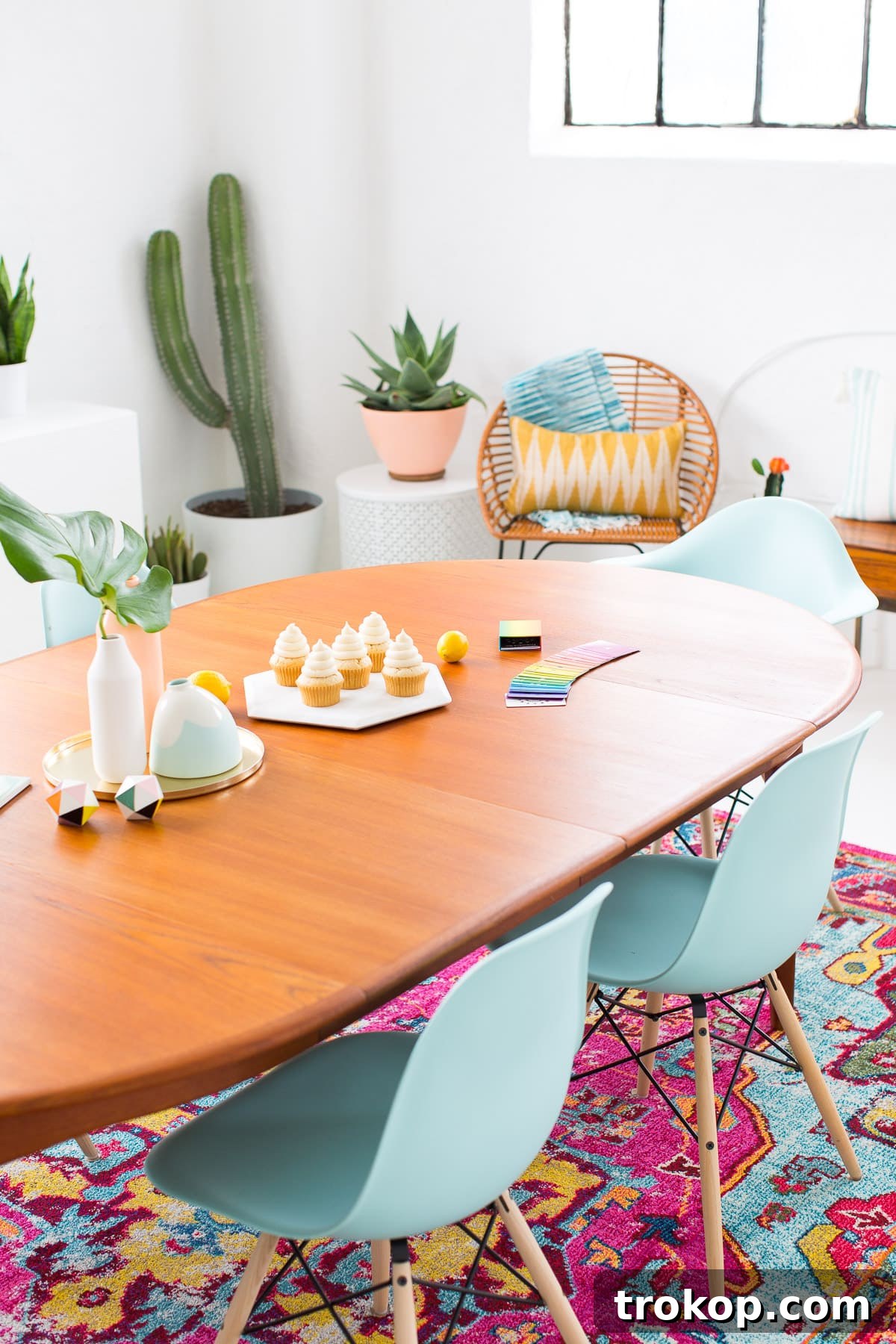 Summer dining room table setting with Blendo glasses, lemons, and cupcakes