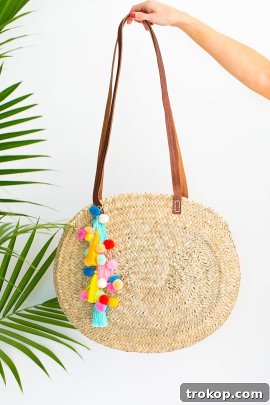 The finished DIY pom pom tassel circle bag, a perfect accessory for summer and unique statement piece.