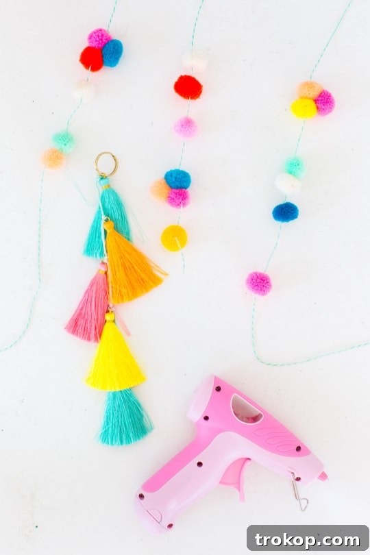 All pom pom and tassel strands assembled on a single keyring, showcasing the complete DIY embellishment.
