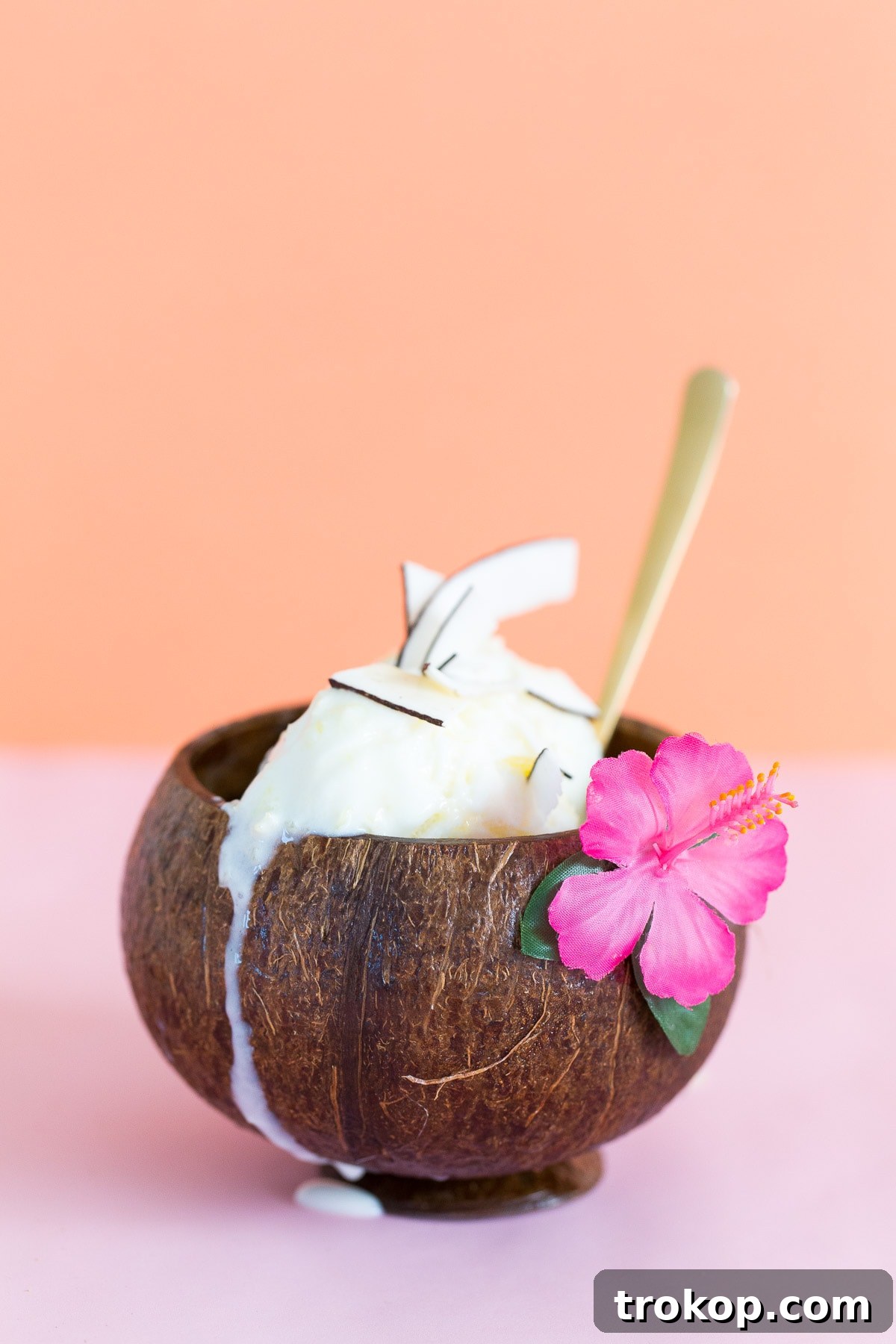 A beautifully scooped homemade No-Churn Creamy Pineapple Coconut Ice Cream, garnished and ready to serve.