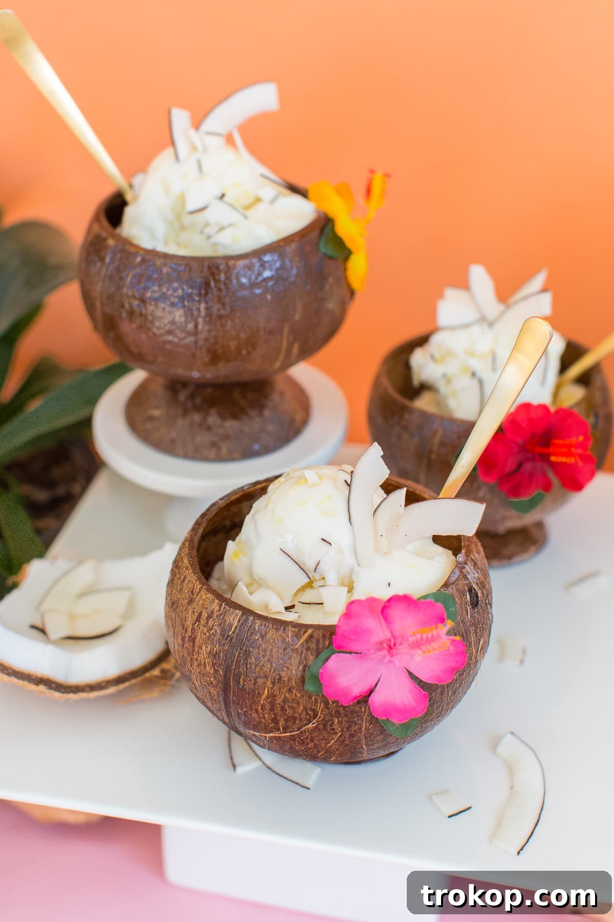 A delightful display of pineapple coconut ice cream in various serving dishes.