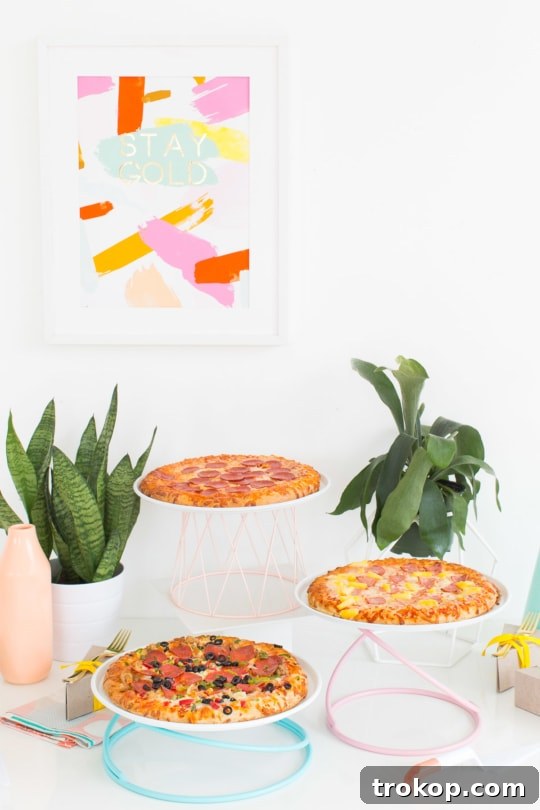 Elevate your pizza party with three clever serving ideas for summer entertaining. Discover DIY colorblock servers, individual slice boxes, and stylish geometric stands.