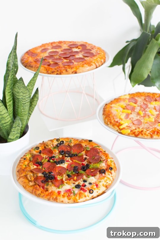 DIY colorful geometric pizza stands elevate your pizza presentation. Spray paint metal stands in custom party colors for a vibrant display.