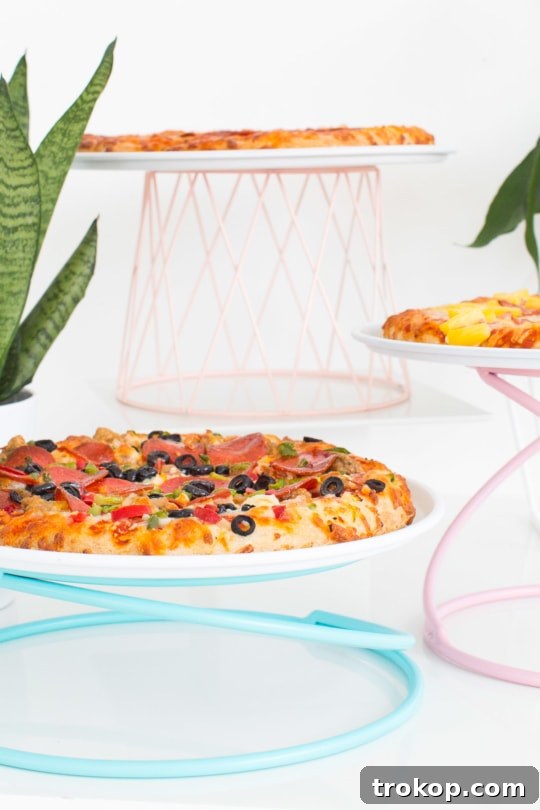 What you need to make DIY colorful geometric pizza stands: plain stands, metal spray paint, and pizza trays. Simple and impactful party decor.