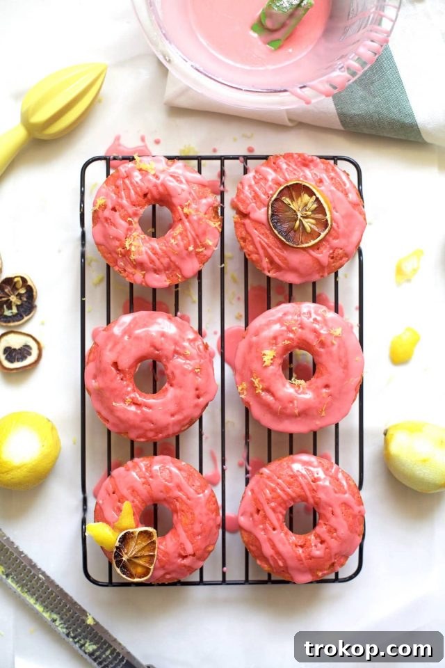 Delightful baked pink lemonade donuts with a sweet citrus glaze