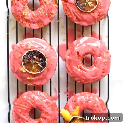 Delightful baked pink lemonade donuts with a sweet citrus glaze