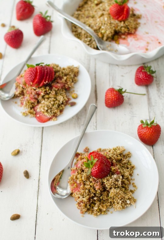 Heavenly Strawberry Pistachio Crumble 2 A vibrant Pistachio Strawberry Crumble with golden topping, ready to be served.