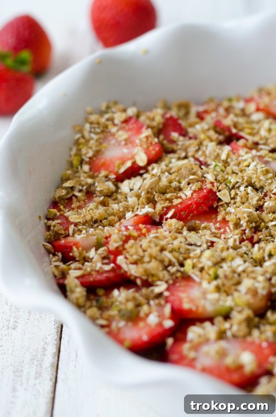 Heavenly Strawberry Pistachio Crumble 3 Close-up of fresh strawberries ready for baking in a Pistachio Strawberry Crumble.