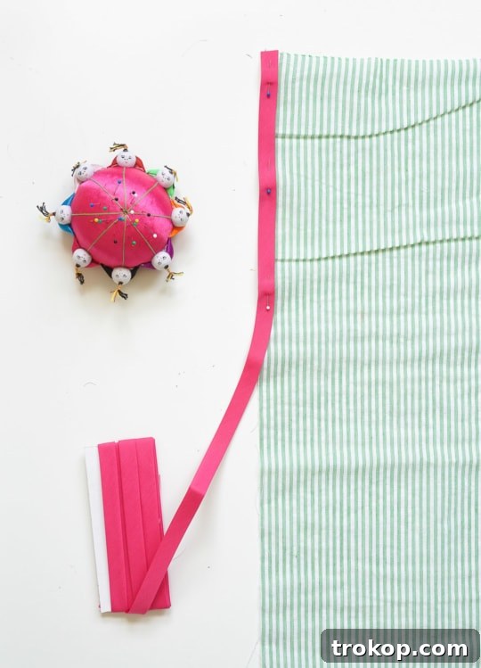 Craft Your Own Seersucker Tea Towels 6 Detailed view of pinning bias tape to fabric edge