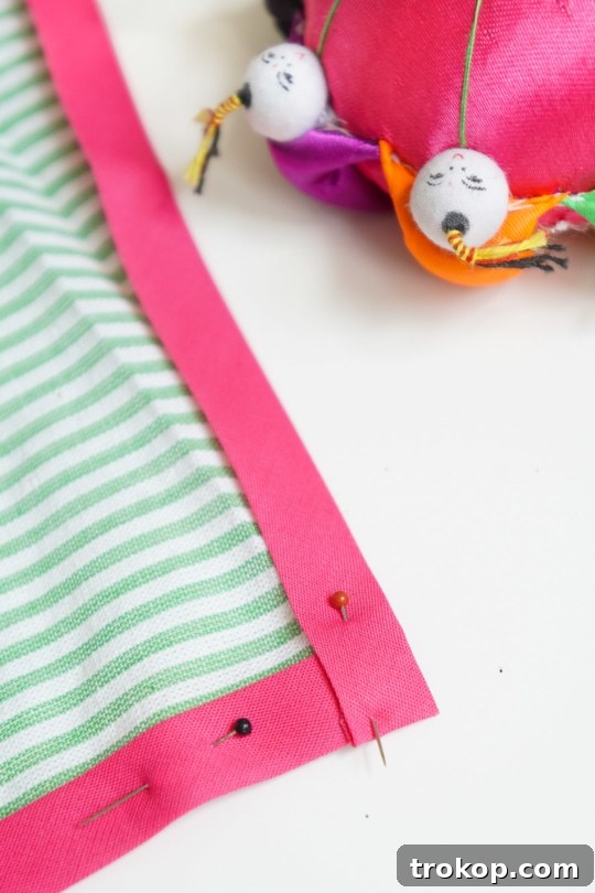Craft Your Own Seersucker Tea Towels 7 Another perspective of pinning bias tape around a corner for DIY tea towels