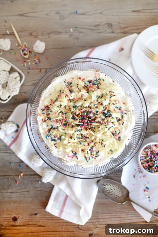 This frosted animal cracker ice box cake is just as tasty as it is pretty! - Sugar & Cloth - Recipe