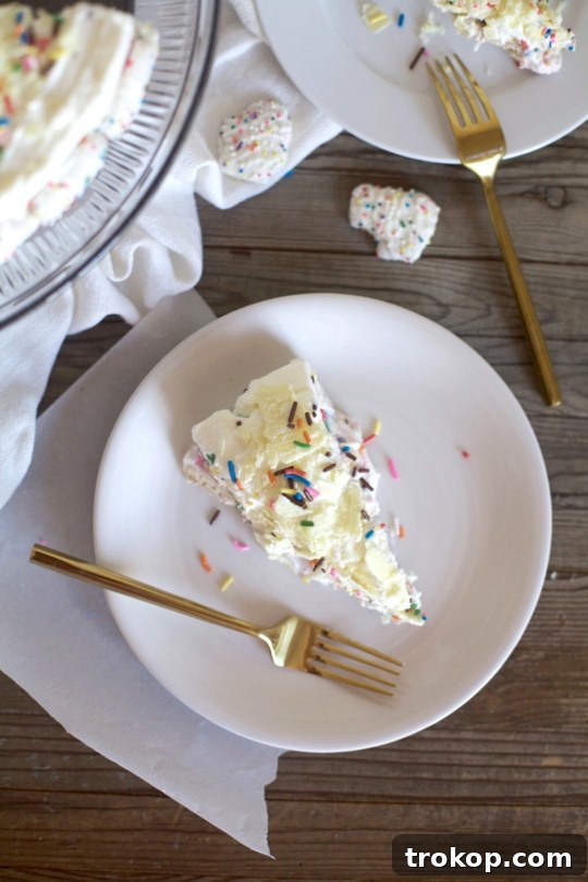This frosted animal cracker ice box cake is just as tasty as it is pretty! - Sugar & Cloth - Recipe
