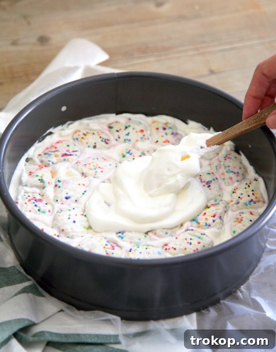 This frosted animal cracker ice box cake is just as tasty as it is pretty! - Sugar & Cloth - Recipe