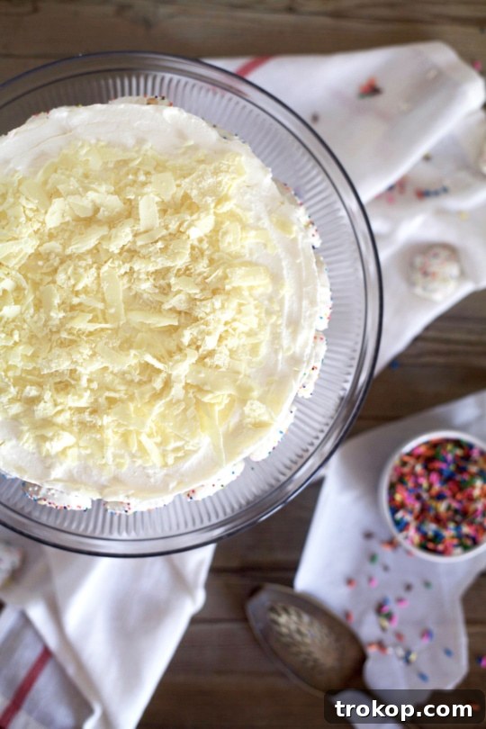 This frosted animal cracker ice box cake is just as tasty as it is pretty! - Sugar & Cloth - Recipe