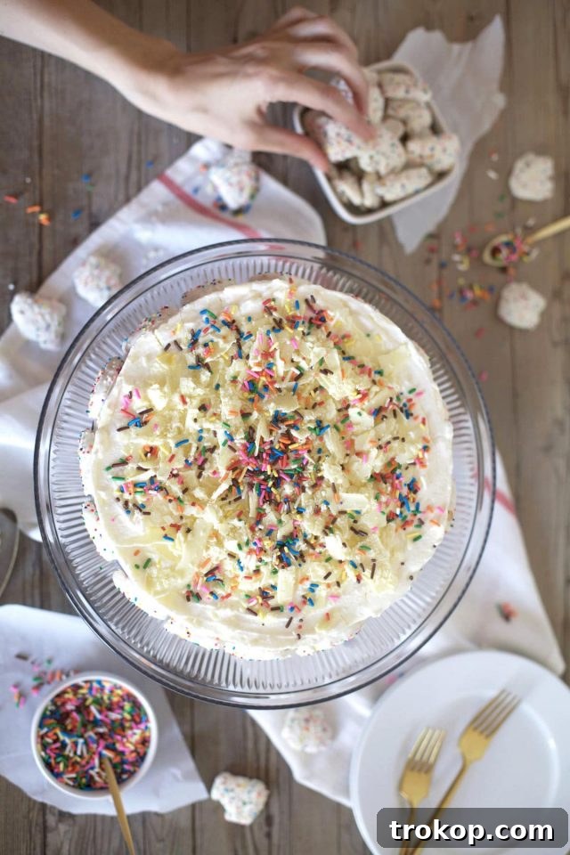 This frosted animal cracker ice box cake is just as tasty as it is pretty! - Sugar & Cloth - Recipe