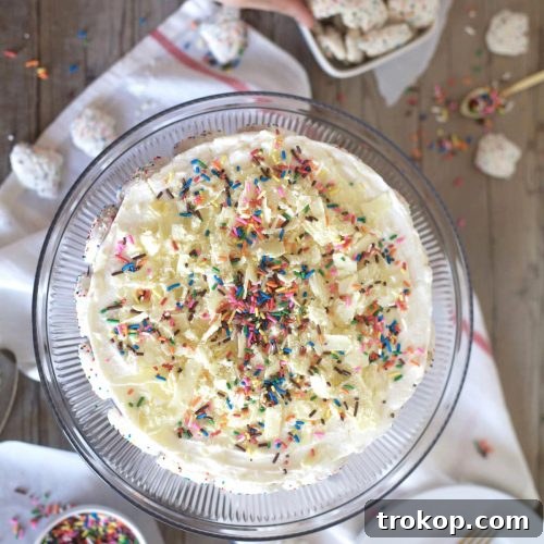 This frosted animal cracker ice box cake is just as tasty as it is pretty! - Sugar & Cloth - Recipe