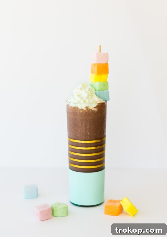 Boozy hot chocolate recipe with whipped cream and chocolate garnish