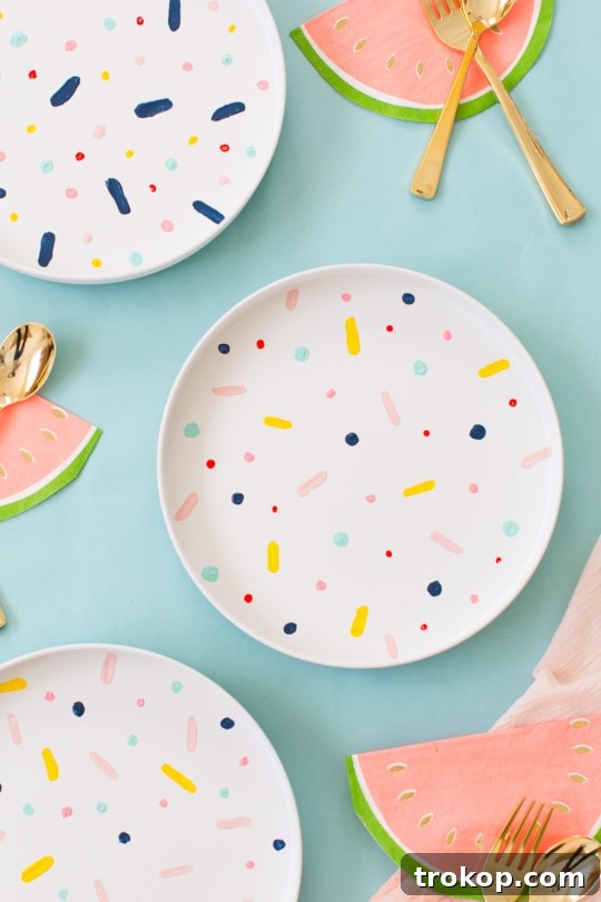 Close-up of a finished DIY confetti pattern placemat, showcasing vibrant abstract dots created with Q-tips on a white background - sugar and cloth