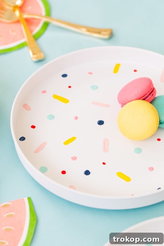 Beautifully styled dining table with DIY confetti pattern placemats, featuring macarons as a delightful centerpiece - sugar and cloth