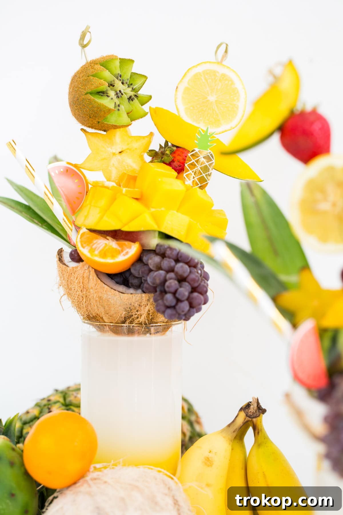 Close-up of a fruit freakshake showing layered garnishes