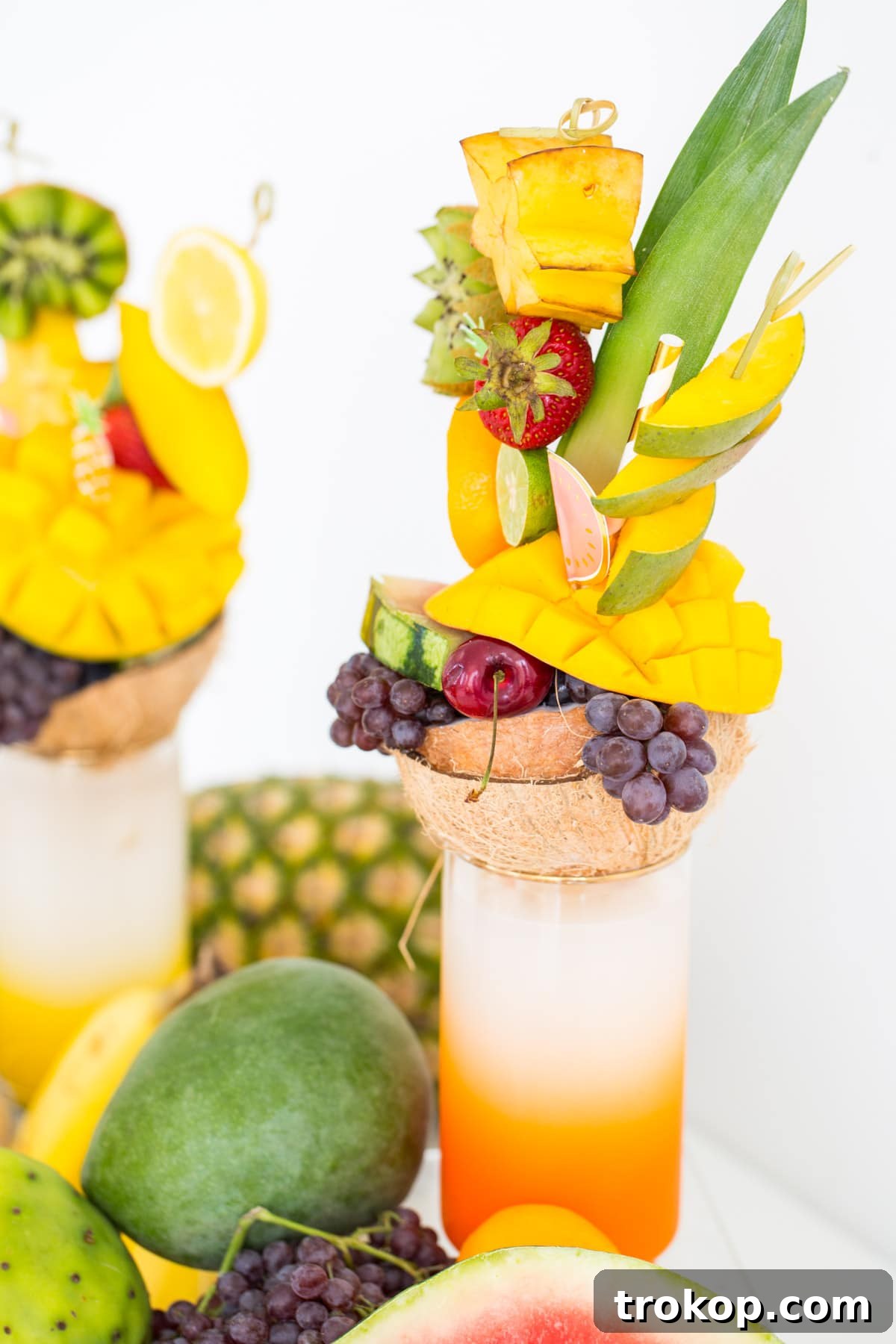 Close-up of a fruit freakshake with stacked fruit and a coconut base