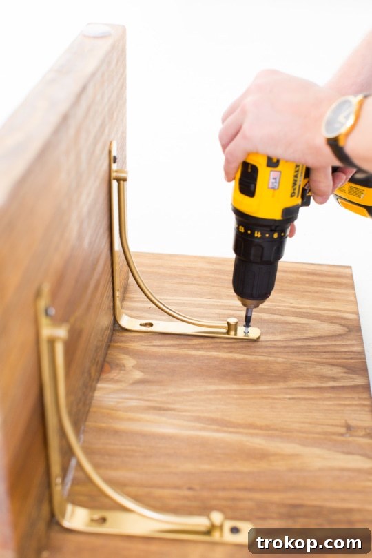Step 6 - DIY Low Floor Table Tutorial, applying adhesive to legs