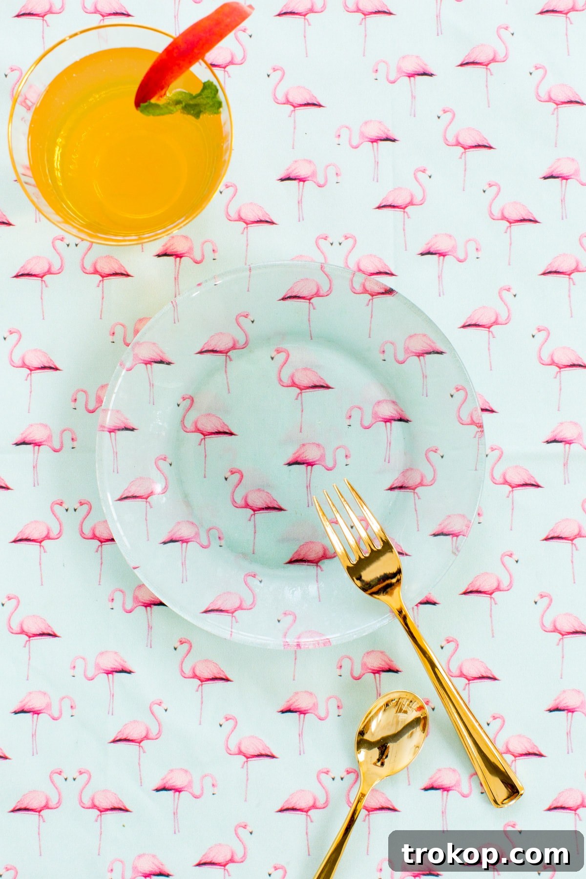DIY Printed Plates and Peachy-Tini Cocktail 4 A stack of brightly patterned DIY printed plates, including a pink flamingo design, ready for a stylish gathering