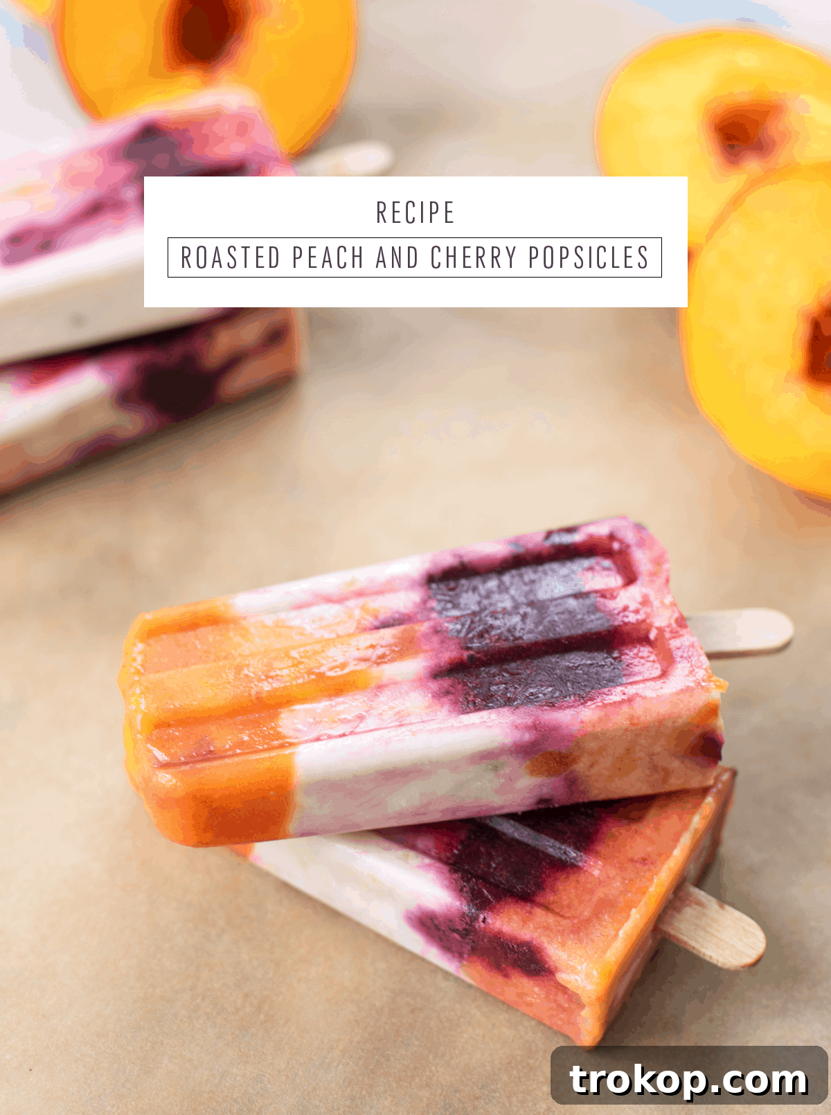 A beautifully arranged serving of Roasted Peach and Cherry Popsicles, emphasizing their vibrant colors and appealing layers