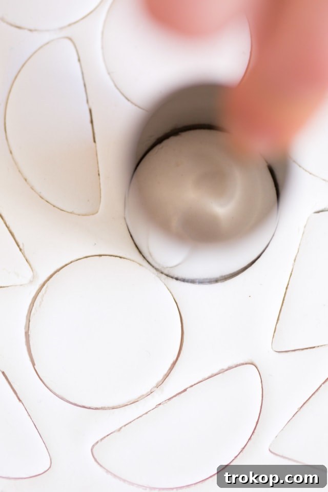 The top portion of a glass bottle meticulously covered with air-dry clay, showcasing a smooth, finished lip and the potential for decorative additions.