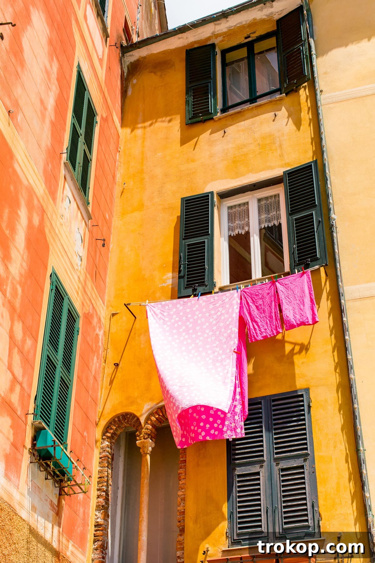 Mediterranean Escapade, Part 2: Aix, Portofino, Cinque Terre, Rome 23 The vibrant atmosphere of Portofino's harbor, adorned with colorful buildings and boats.