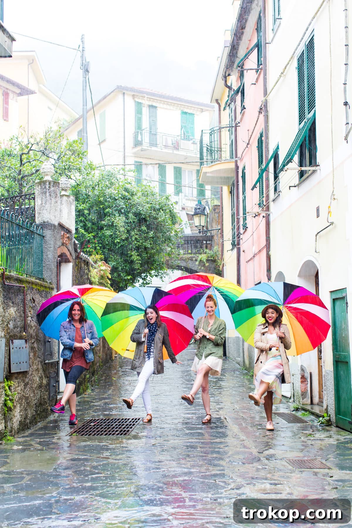 Mediterranean Escapade, Part 2: Aix, Portofino, Cinque Terre, Rome 27 Embracing the rain with colorful umbrellas in Cinque Terre, a memorable European travel experience.