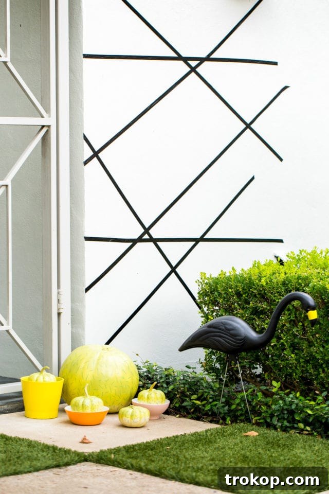 Washi tape makes for an easy and stylish Palm Springs Inspired Halloween Entryway Decor.