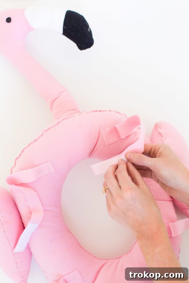 Stuffing the flamingo head and neck for proper shape