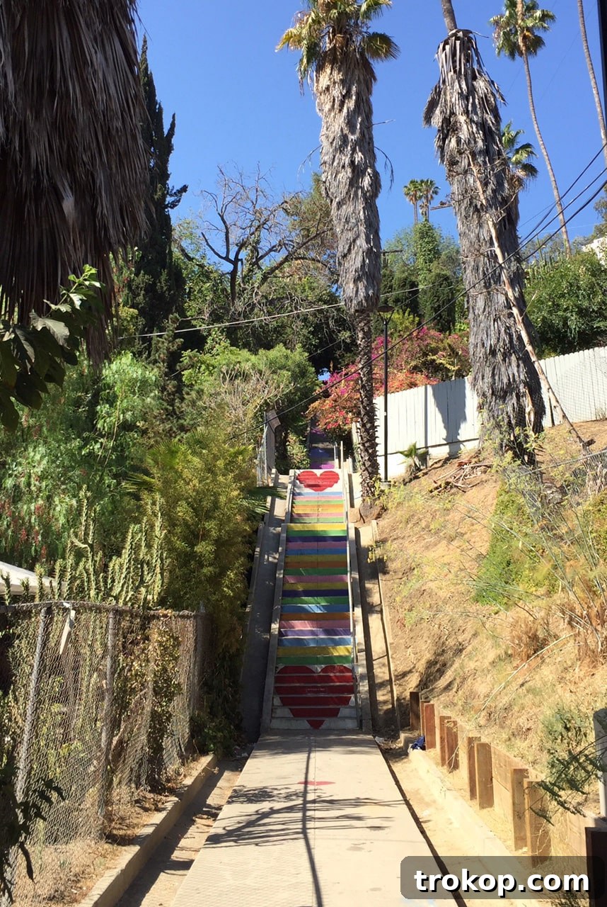 Ashley Rose filming in Los Angeles at a colorful stairwell, capturing creative inspiration for her Huffington Post interview feature.