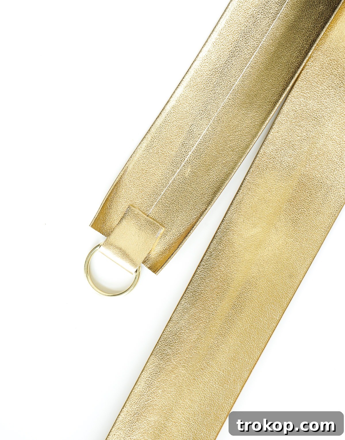 Cutting 1-inch by 5/8-inch vertical rectangular notches at both ends of the metallic gold belting trim for the DIY camera strap.