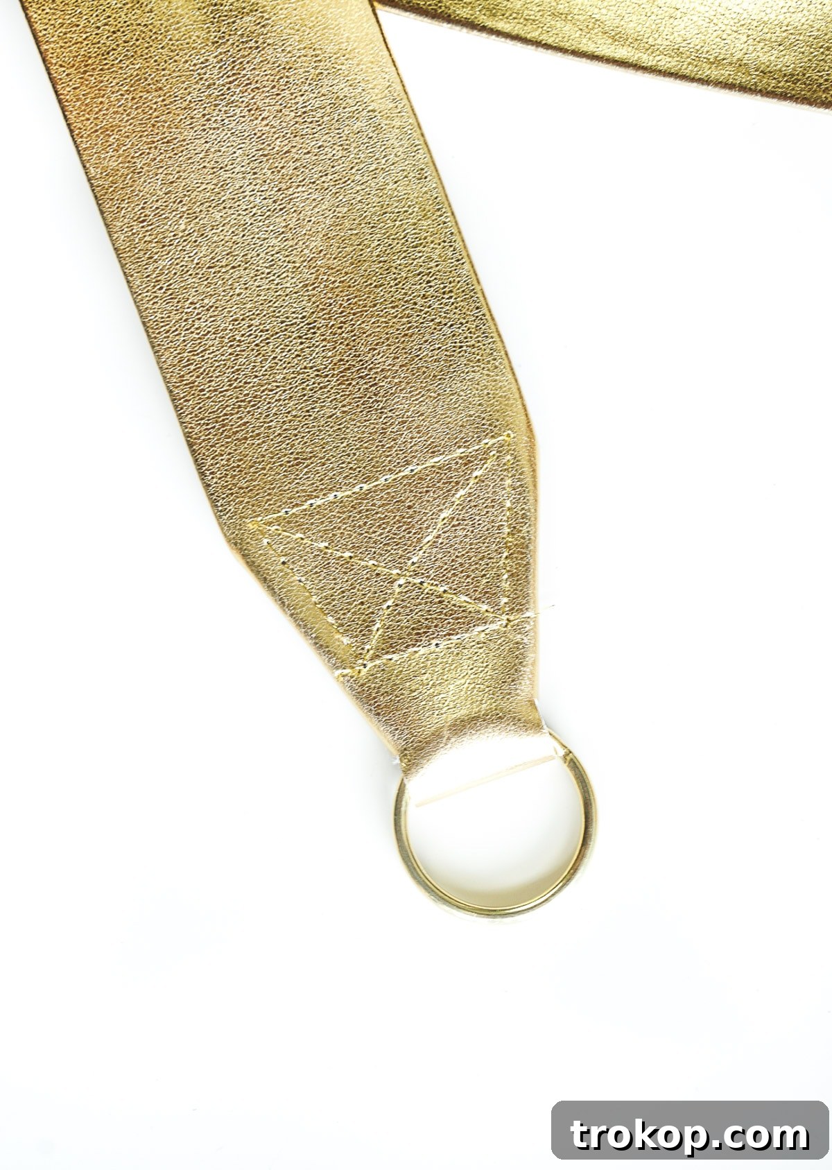Detailed view of the finished trapezoid stitching on the DIY camera strap end, reinforced with diagonal lines for extra strength and durability.