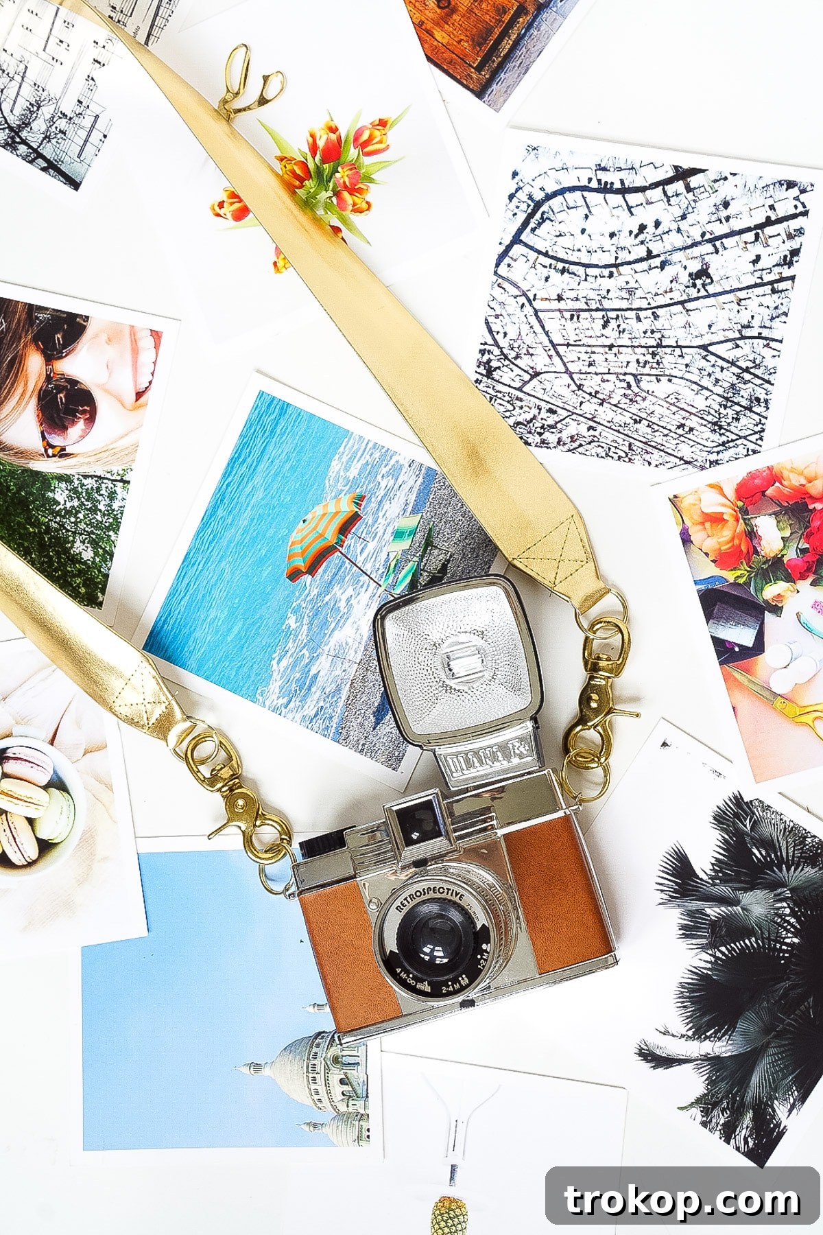 A stylish woman proudly displaying her new DIY Glam Camera Strap with a camera attached, ready for her next adventure.