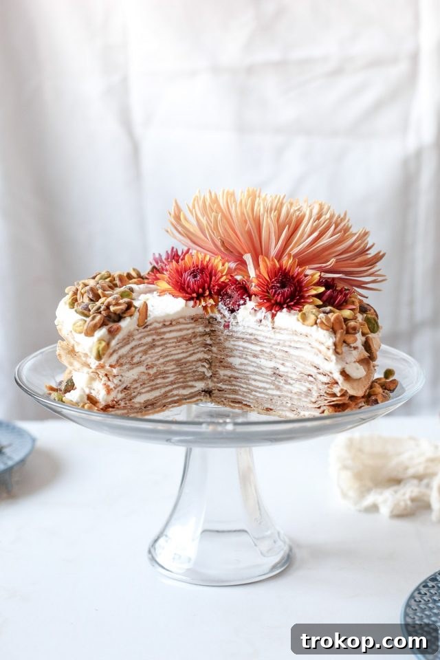 photo of a sliced chai crepe cake recipe by sugar and cloth