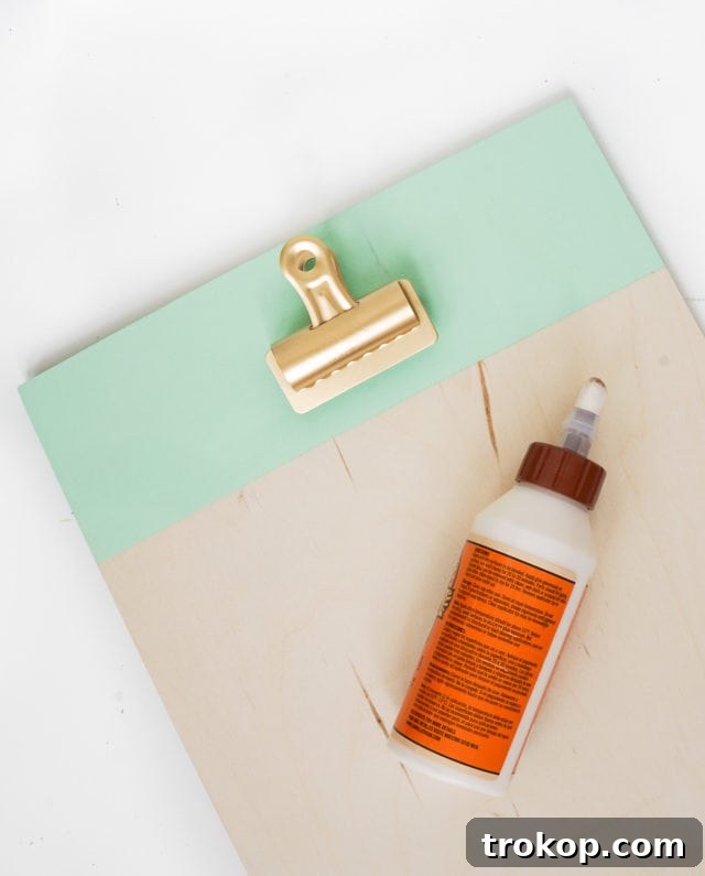 Craft Your Own Clip Memo Board 8 Securing the Picture Hanger with Industrial Adhesive and Allowing it to Dry